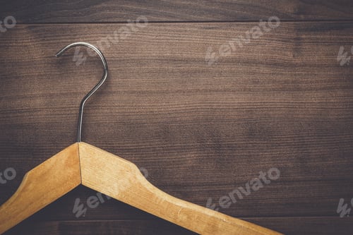 Preview: Wooden Hanger on a Dark Wooden Background