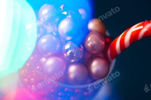 Preview: Little christmas baubles in wineglasses on a dark background
