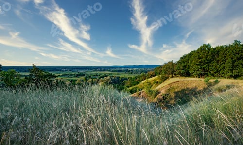 Preview: Panoramic landscape of valley from hill