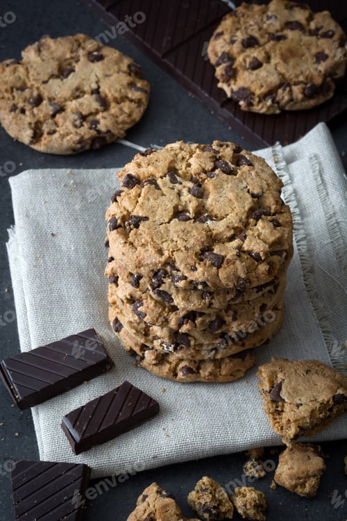 Preview: Stack of chocolate chip cookies with chocolate chunks on rustic linen napkin