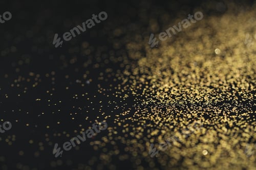 Preview: Beautiful shiny golden glitter on black background, closeup