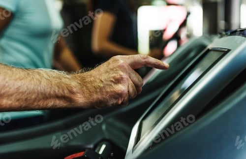 Preview: People exercising at fitness gym