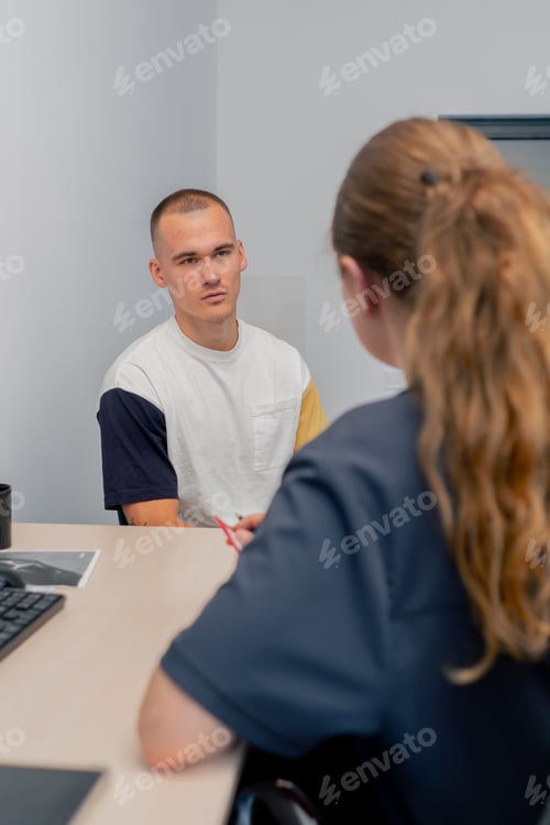 Preview: in a modern clinic in a small therapist s office, a young girl doctor with a stethoscope conducts an