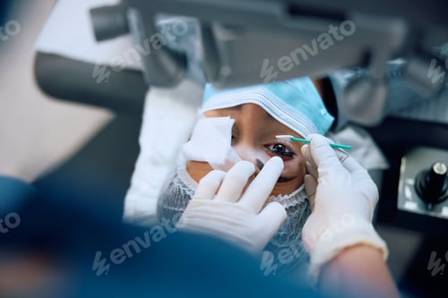 Preview: Close up of woman during eye laser surgery at ophthalmology clinic.