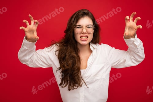 Preview: Photo of young emotional attractive brunet lady with sincere emotions wearing casual white shirt and