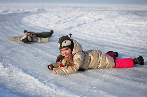 Preview: Happy family having fun at winter walk outdoors