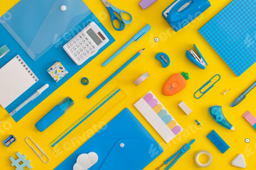 Preview: Pattern composition of school stationery on a yellow background. Top view. Flat lay.