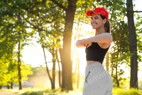 Preview: Young woman doing morning exercise in park, space for text