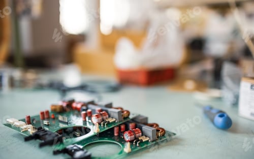 Preview: Close-up electric green embedded microcircuits in production