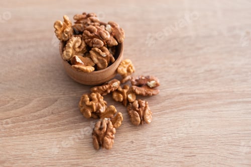 Preview: Peeled walnuts. On a wooden board. Healthy food. Natural background.
