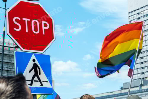 Preview: Gay pride, LGBTQ rainbow flags being waved in the air at a pride event. wave LGBTQ gay pride flags