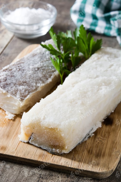 Preview: Salted codfish with parsley on cutting board, preserving fish for extended storage