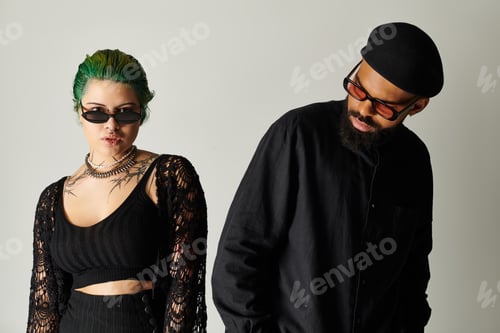 Preview: Stylish multicultural couple showcases trendy outfits in studio setting