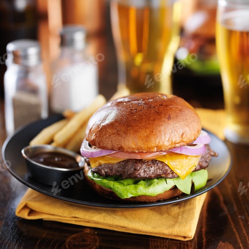 Preview: cheeseburgers and fries shot with selective focus