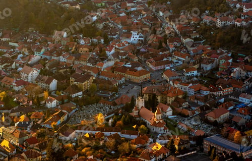 Preview: Aerial view of a European town with red roofs and a church.
