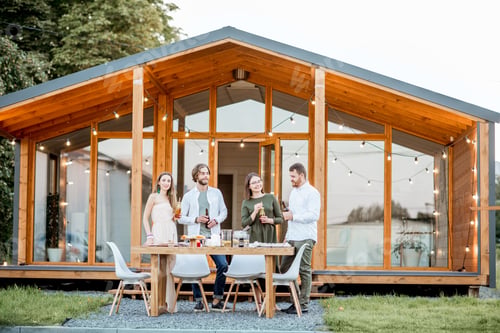 Preview: Friends with drinks on the backyard of the house