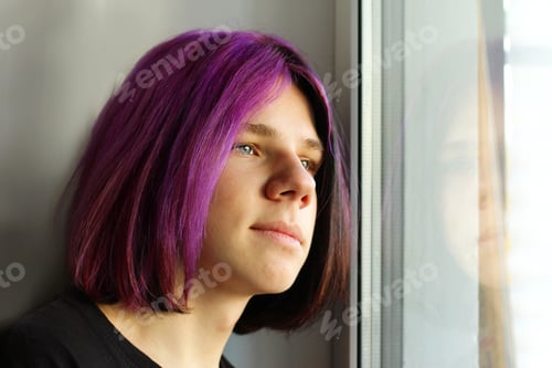 Preview: A Trendy boy with purple hair. mental health, transitional age. A color image of a teenage boy