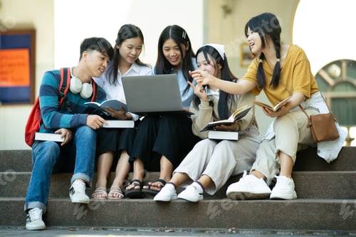 Preview: Group of students studying on campus outdoors