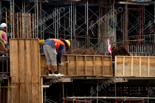 Preview: Construction workers fabricating steel reinforcement bar at the construction site