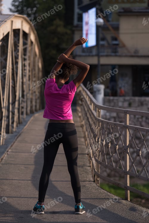 Preview: Black woman doing warming up and stretching
