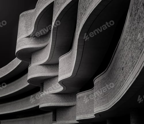 Preview: Low angle greyscale of a building with modern brutalist architecture under the sunlight