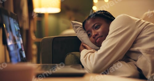 Preview: African woman, laptop and movie on sofa to relax in night for vacation, break and online subscripti