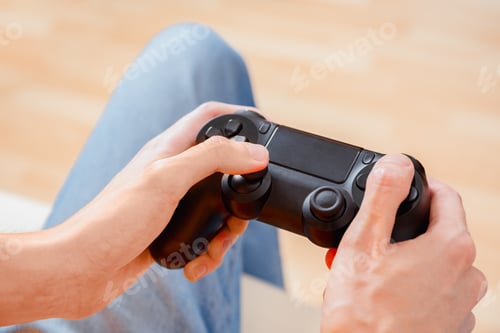 Preview: Thumbs on Buttons Holding Video Game Controller