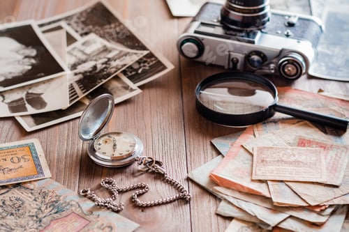 Preview: A watch on a chain, aged ruble bills, a film camera and black and white photographs