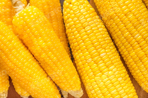 Preview: top view group of corn cob on wood table