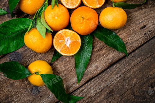 Preview: Tangerine, mandarines, clementine, citrus fruits with leaves on wooden table