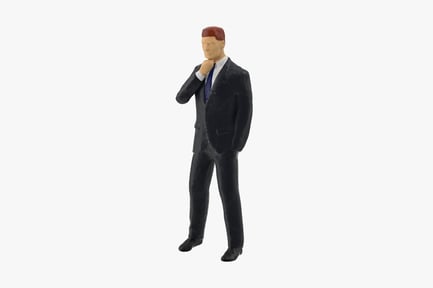 Preview: Pensive Miniature Businessman in Suit