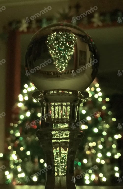 Preview: Christmas tree with white lights reflected in a Lens Ball