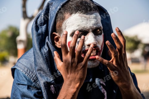 Preview: Close-up portrait of a horrible scary zombie man. Horror. Halloween.