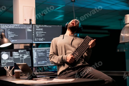 Preview: Database programmer playing guitar with keyboard