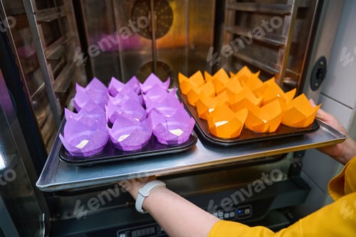 Preview: Experienced pastry chef baking batch of muffins