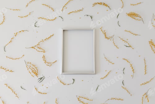 Preview: mockup with yellow mimosa flowers and blank photo frame with copy space. Spring, Easter concept.