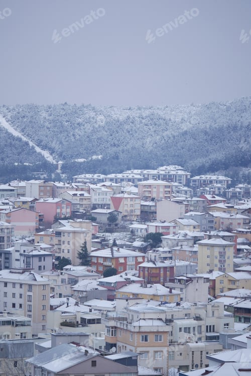Preview: Winter landscape with snow-covered buildings in the city