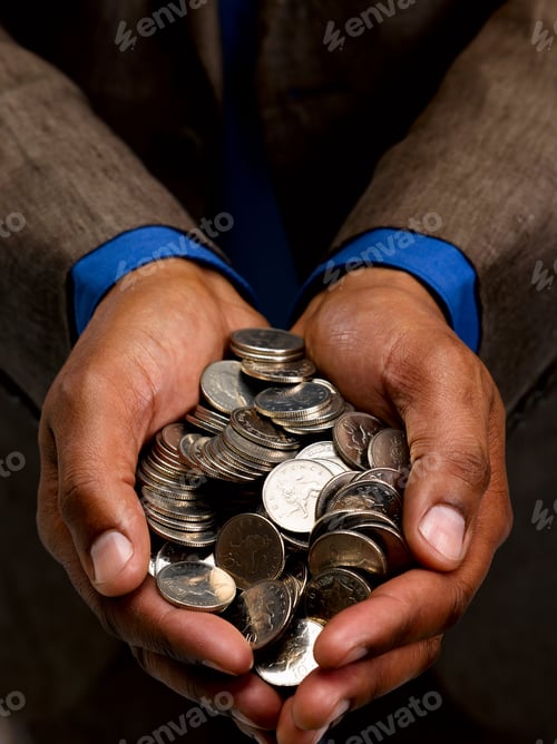 Preview: Business man with handful of coins