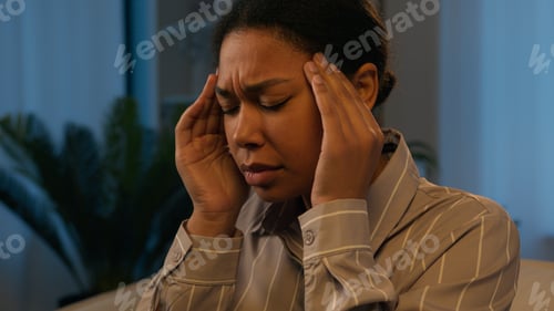 Preview: Sick African American woman use mobile phone gadget addict at night evening home ill unhealthy girl