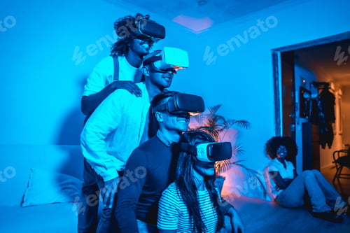 Preview: Four young people with vr glasses in a virtual reality game in a blue light, in formation