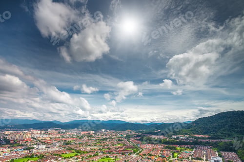 Preview: cityscape and mountains against blue sky