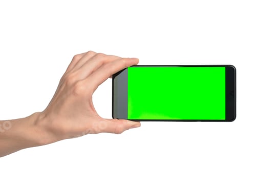 Preview: Smartphone with blank green display in female hand on white background, isolate