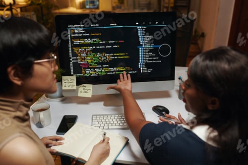 Preview: Developers Discussing Programming Code