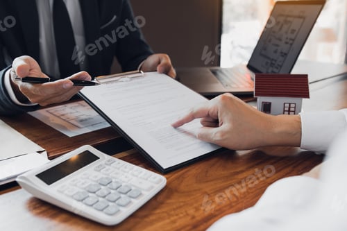 Preview: Businessmen Reviewing Documents and Discussing Real Estate