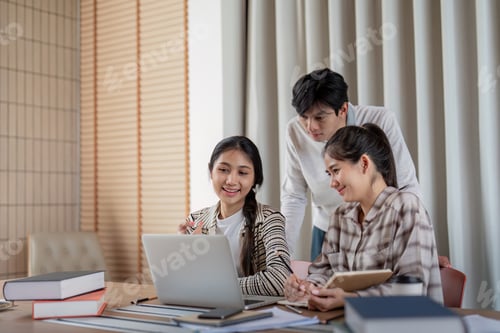 Preview: Group of Student Collaborationon a Project with a Laptop in a Modern Study Space