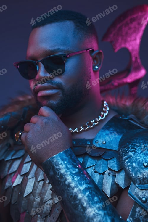 Preview: African man with sunglasses holding axe on his shoulder
