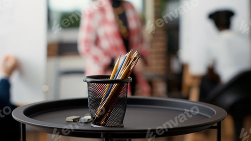 Preview: Artistic tools and colorful pencils on table in art class workshop