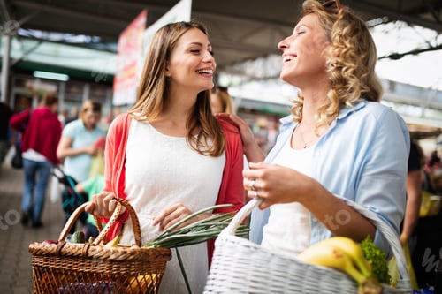 Preview: Beautiful happy women shopping vegetables and fruits
