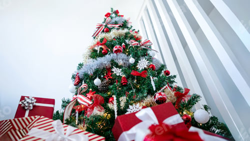 Preview: Beautiful wrapped gift boxes under a modern Christmas tree home. Fir Xmas