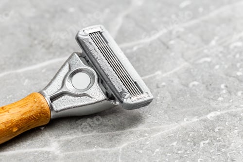 Preview: Shaving Razor with wooden handle on a grey marble